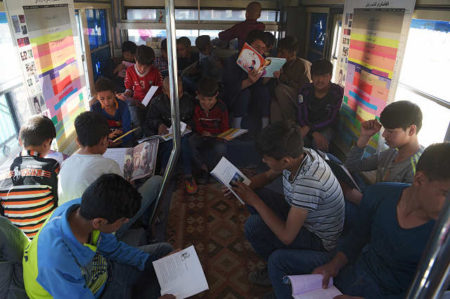 afghan youths read books in a mobile library bus in kabul the door of the blue bus slides open and dozens of children excitedly bound up the steps eager to get their hands on hard to find books in kabul 039 s first mobile library photo afp afghan youths read books in a mobile library bus in kabul the door of the blue bus slides open and dozens of children excitedly bound up the steps eager to get their hands on hard to find books in kabul 039 s first mobile library photo afp