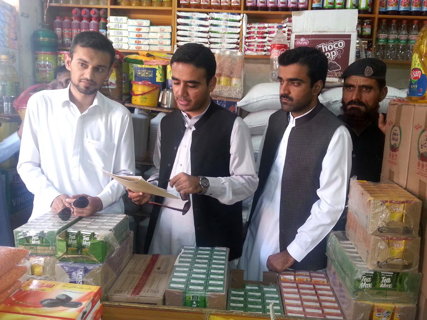 loralai assistant commissioner mir baz mari is checking the rate list at a shop photo express