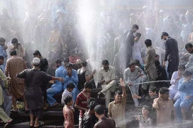 residents of haroonabad beat the heat by showering in the water of a leaky pipeline photo mohammad noman express residents of haroonabad beat the heat by showering in the water of a leaky pipeline photo mohammad noman express