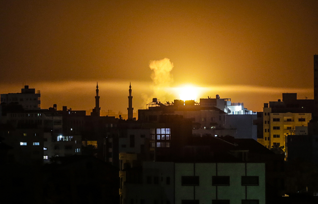 an explosion is seen in gaza city after an airstrike by israeli forces on june 2 2018 photo afp an explosion is seen in gaza city after an airstrike by israeli forces on june 2 2018 photo afp