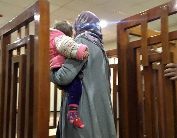 this file photo taken on february 19 2018 shows french jihadist melina boughedir carriyng her son arriving in court in the iraqi capital baghdad photo afp this file photo taken on february 19 2018 shows french jihadist melina boughedir carriyng her son arriving in court in the iraqi capital baghdad photo afp