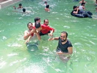 a sigh of relief youngsters throng to pools tube wells in multan a sigh of relief youngsters throng to pools tube wells in multan