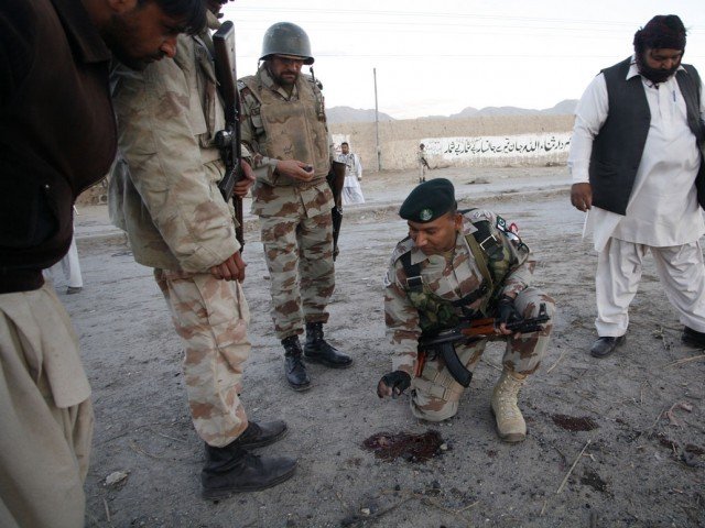 paramilitary soldiers survey a bomb attack site in quetta december 10 2012 photo reuters