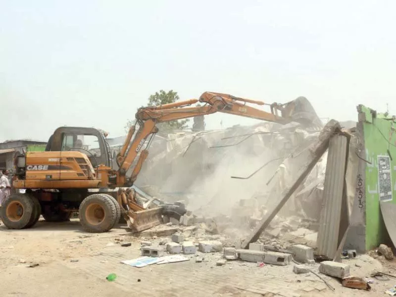 cda staff use an excavator to tear down encroachment photo express cda staff use an excavator to tear down encroachment photo express