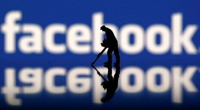 a figurine is seen in front of the facebook logo in this illustration taken march 20 2018 photo reuters