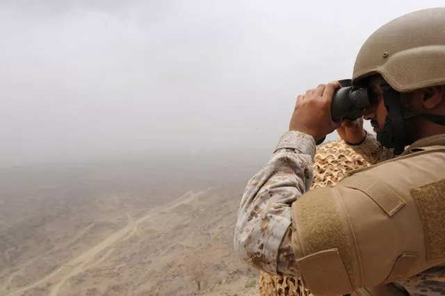 a saudi soldier looks through binoculars from a position on the saudi yemeni border photo afp a saudi soldier looks through binoculars from a position on the saudi yemeni border photo afp