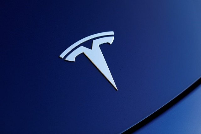 the front hood logo on a 2018 tesla model 3 electric vehicle is shown in this photo illustration taken in cardiff california us june 1 2018 photo reuters