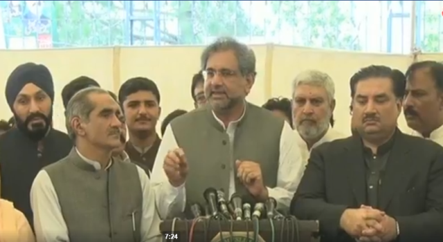 shahid khaqan abbasi flanked by ahsan iqbal and khurram dastagir address the media photo express