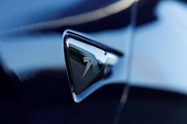 the logo on a 2018 tesla model 3 electric vehicle is shown in cardiff california us in this picture taken june 1 2018 photo the logo on a 2018 tesla model 3 electric vehicle is shown in cardiff california us in this picture taken june 1 2018 photo