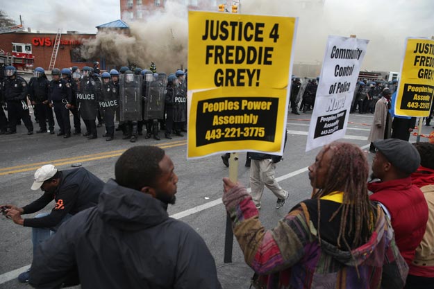 demonstrators face off with baltimore police at a protest following the funeral of freddie gray april 27 2015 in baltimore maryland photo afp