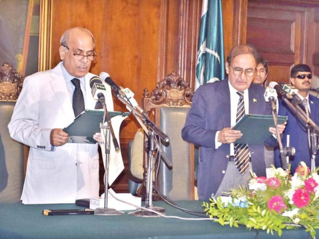 punjab governor malik muhammad rajwana administers oath to punjab caretaker chief minister dr hasan askari at governor house on friday photo app