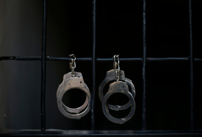 two held for occupying land