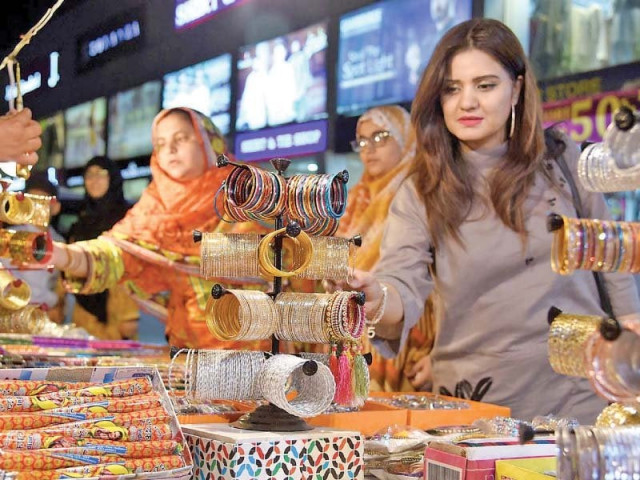 women buy bangles and henna at a stall in islamabad s super market photo inp women buy bangles and henna at a stall in islamabad s super market photo inp