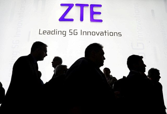 visitors pass in front of the chinese telecoms equipment group zte booth at the mobile world congress in barcelona spain february 26 2018 photo reuters visitors pass in front of the chinese telecoms equipment group zte booth at the mobile world congress in barcelona spain february 26 2018 photo reuters