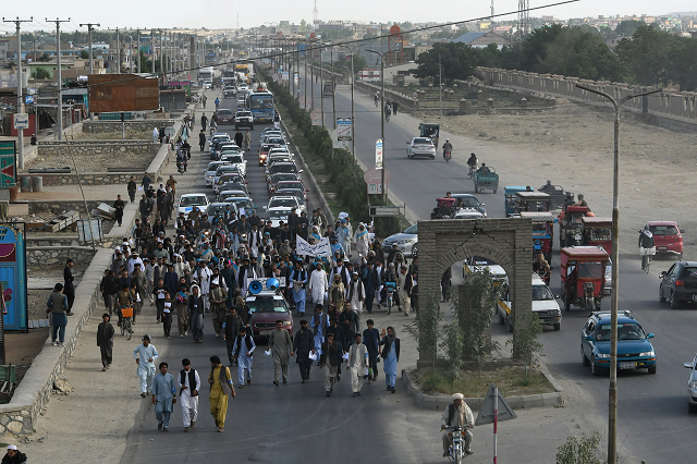 every day the protesters run the gauntlet of roadside bombs armed robbers and militants photo afp