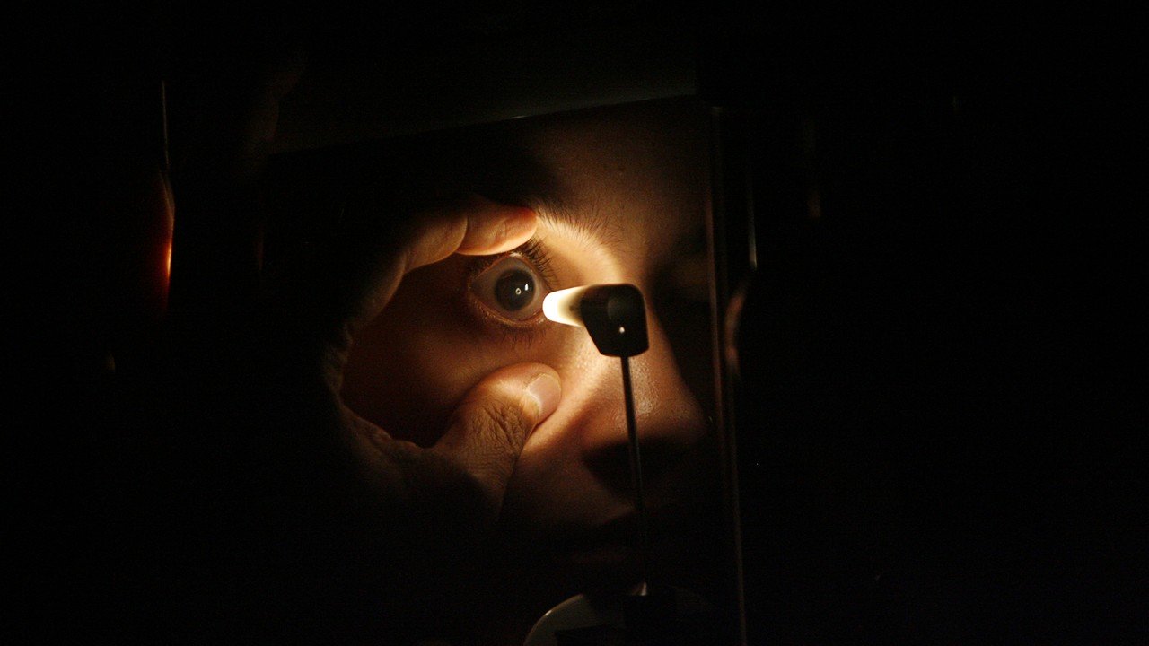 a doctor checks the eye of a patient photo reuters