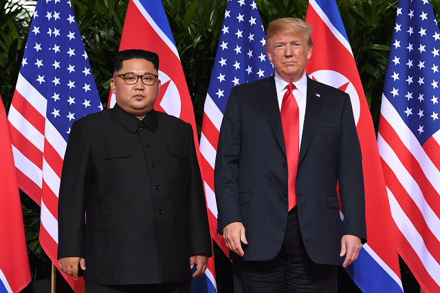 us president donald trump r and north korea 039 s leader kim jong un l pose together at the start of their historic us north korea summit at the capella hotel on sentosa island in singapore on june 12 2018 donald trump and kim jong un have become on june 12 the first sitting us and north korean leaders to meet shake hands and negotiate to end a decades old nuclear stand off photo afp us president donald trump r and north korea 039 s leader kim jong un l pose together at the start of their historic us north korea summit at the capella hotel on sentosa island in singapore on june 12 2018 donald trump and kim jong un have become on june 12 the first sitting us and north korean leaders to meet shake hands and negotiate to end a decades old nuclear stand off photo afp