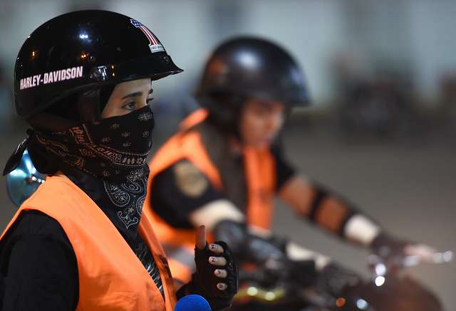 a picture taken june 3 2018 shows saudi noura preparing for a training session at the bikers skills institute a motorcycle driving school on the outskirts of riyadh even a year ago it would have been hard to imagine    saudi women clad in skinny jeans and harley davidson t shirts revving motorbikes at a riyadh sports circuit but ahead of the historic lifting of a decades long ban on female drivers on june 24 women gather weekly at the privately owned bikers skills institute to learn how to ride bikes photo afp