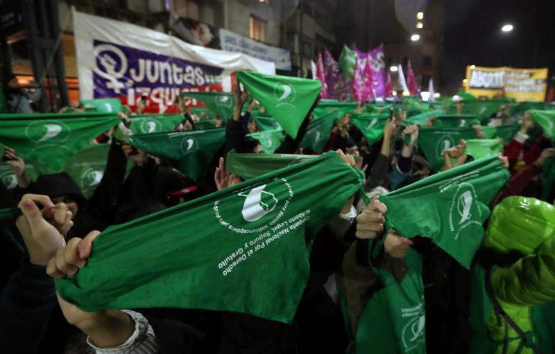 demonstrators hold up green handkerchiefs during a demonstration in favor of legalizing abortion outside the congress in buenos aires argentina photo reuters