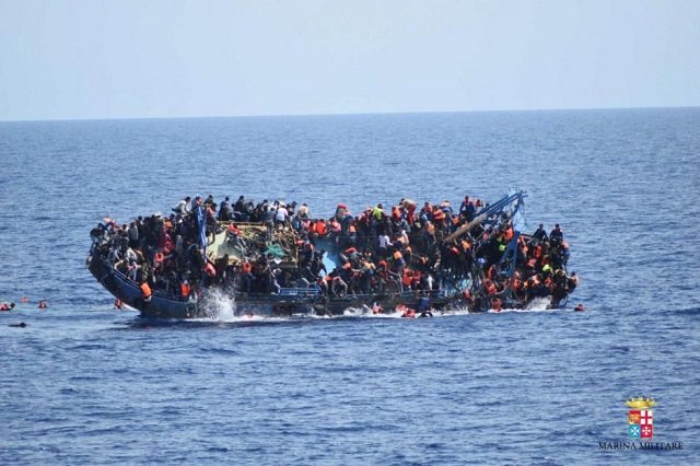 migrants are seen on a boat near italy photo reuters