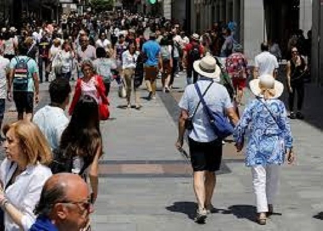 tourists walk up one of the main shopping areas preciados street in central madrid spain june 14 2018 photo reuters