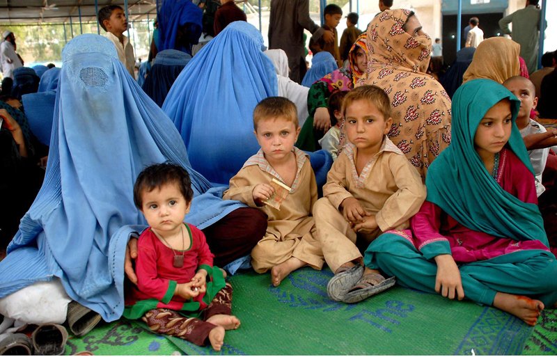 afghan refugees are seen sitting in a camp photo inp file