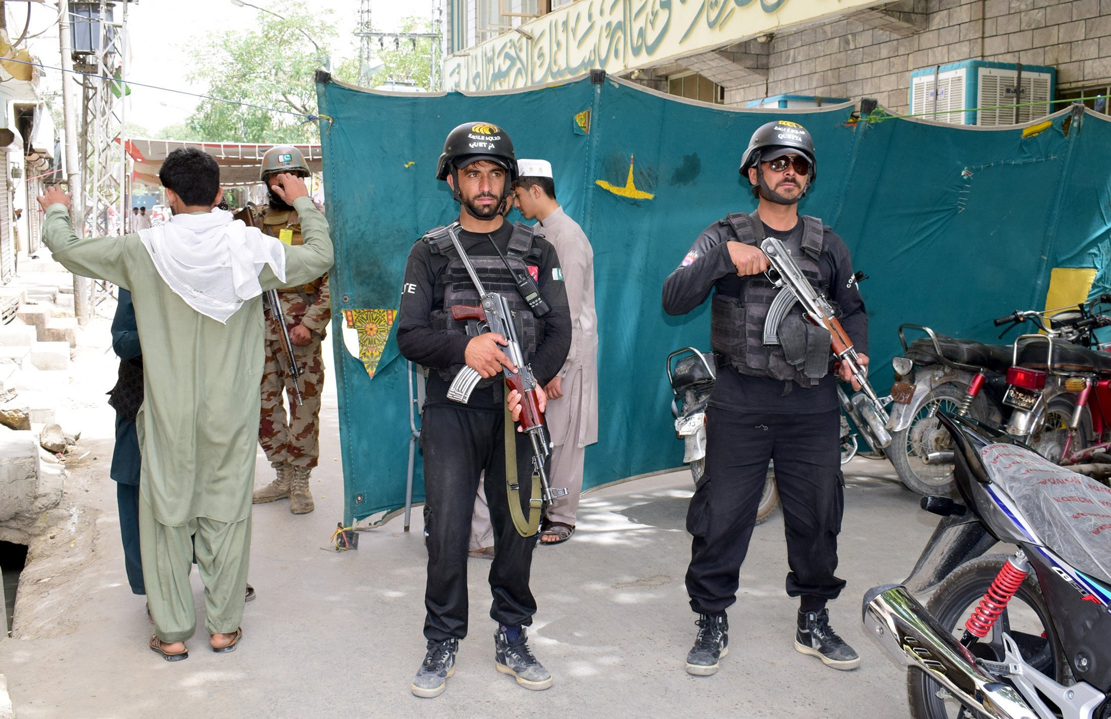 security personnel stand guard outside a mosque where jumatul wida prayers are being held photo express