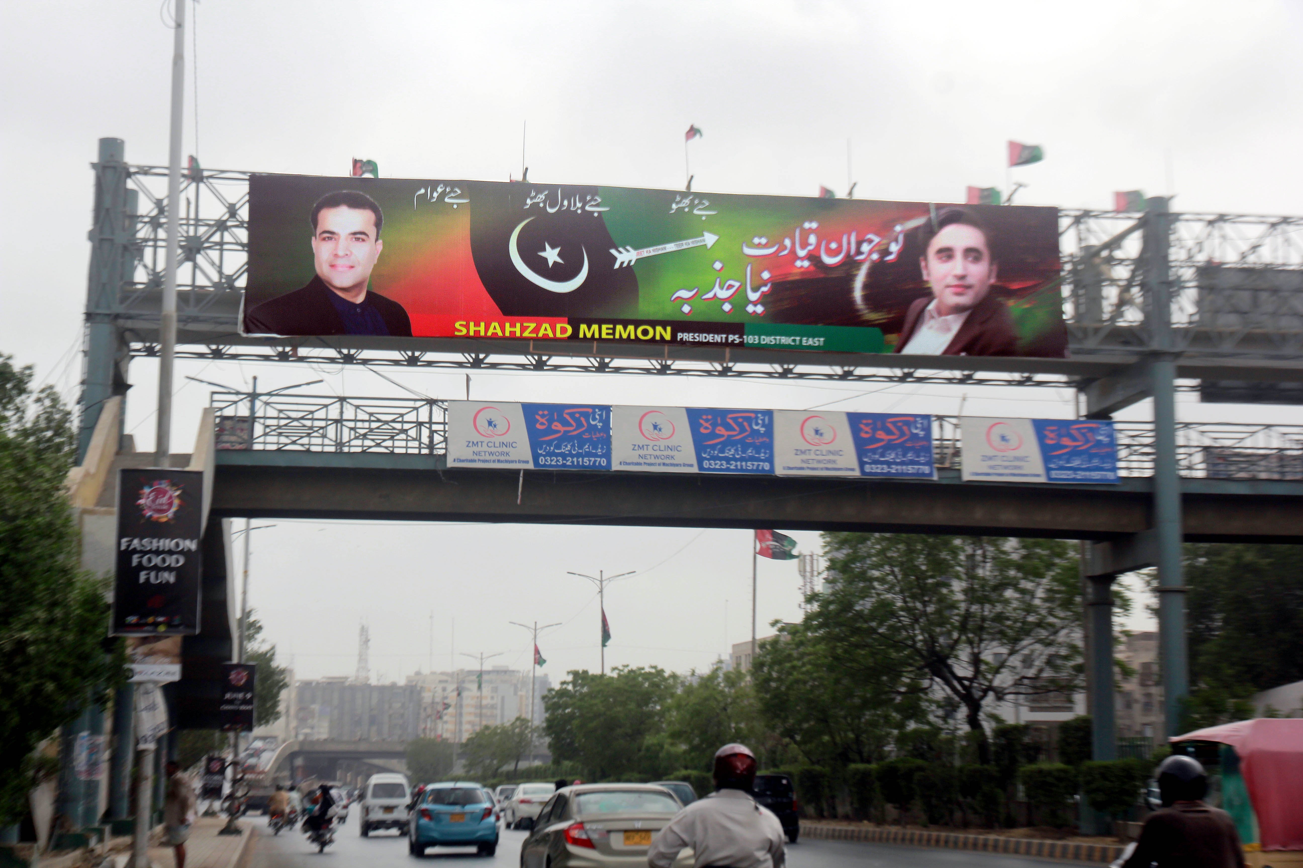defying court orders political parties deface karachi in run up to elections
