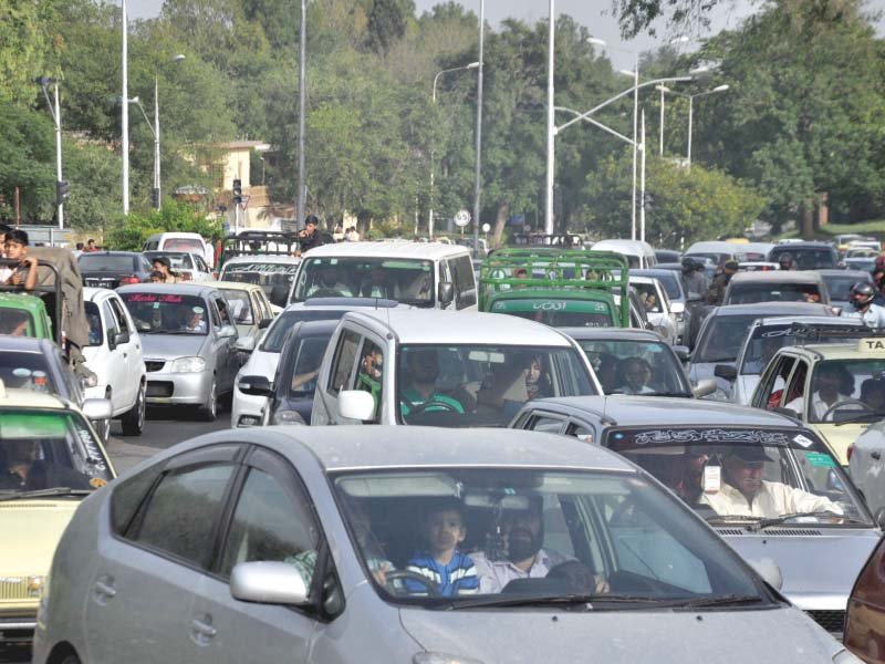 people stuck in traffic near daman e koh photo express