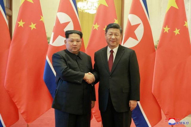 north korean leader kim jong un shakes hands with chinese president xi jinping in beijing photo reuters north korean leader kim jong un shakes hands with chinese president xi jinping in beijing photo reuters