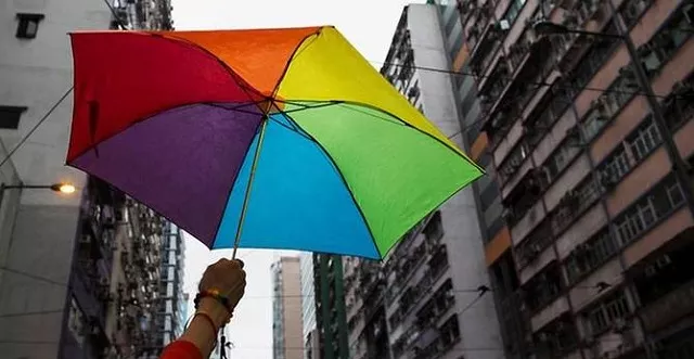 a participant holds a rainbow umbrella as he attends a lesbian gay bisexual and transgender lgbt pride parade in hong kong november 8 2014 photo reuters a participant holds a rainbow umbrella as he attends a lesbian gay bisexual and transgender lgbt pride parade in hong kong november 8 2014 photo reuters