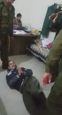 the identity of the man or the police officers has not been ascertained as yet photo screen grab the identity of the man or the police officers has not been ascertained as yet photo screen grab