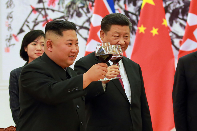 xi told kim that china quot speaks highly quot of his summit with trump and he urged washington and pyongyang to implement their agreement struck in singapore photo afp