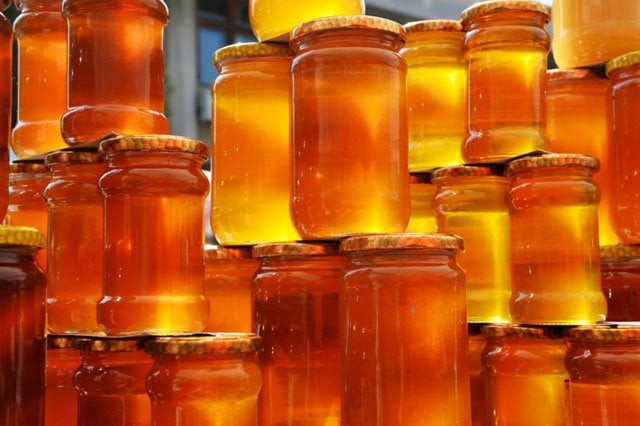 honey producers told to stop using blue plastic cans photo afp