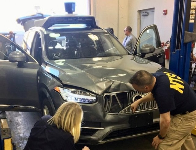 file photo u s national transportation safety board ntsb investigators examine a self driving uber vehicle involved in a fatal accident in tempe arizona u s march 20 2018 a woman was struck and killed by the vehicle on march 18 2018 photo reuters file photo u s national transportation safety board ntsb investigators examine a self driving uber vehicle involved in a fatal accident in tempe arizona u s march 20 2018 a woman was struck and killed by the vehicle on march 18 2018 photo reuters