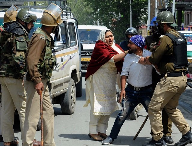 congress leader agrees with musharraf on kashmiri independence pictured here are protestors and security personnel in srinagar photo afp