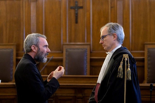 father carlo alberto capella a catholic priest sentenced to five years in jail for possessing child pornography talks with his lawyer during a trial at the vatican june 23 2018 photo reuters