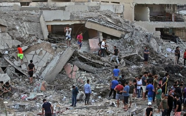 iraqis inspect the aftermath of an explosion in an arms depot in baghdad 039 s sadr city district on june 7 2018 that killed at least 16 people photo afp iraqis inspect the aftermath of an explosion in an arms depot in baghdad 039 s sadr city district on june 7 2018 that killed at least 16 people photo afp