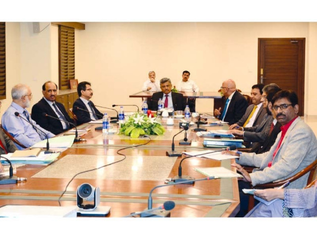 the meeting was attended by senior officers of the corporation photo file the meeting was attended by senior officers of the corporation photo file
