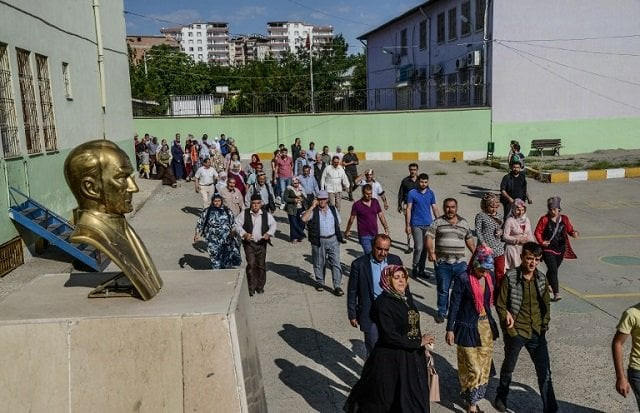 people arrive at a polling station to vote in snap twin turkish presidential and parliamentary elections in the kurdish stronghold of diyarbakir in southeastern turkey on june 24 2018 photo afp people arrive at a polling station to vote in snap twin turkish presidential and parliamentary elections in the kurdish stronghold of diyarbakir in southeastern turkey on june 24 2018 photo afp