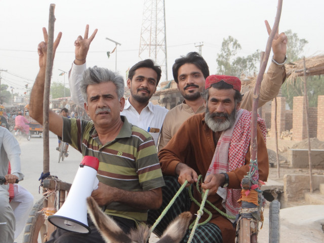 with a loudspeaker in his hand ustad liaquat mirani has been visiting every corner of his constituency on foot and on carts to persuade people to vote for him photo express with a loudspeaker in his hand ustad liaquat mirani has been visiting every corner of his constituency on foot and on carts to persuade people to vote for him photo express