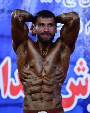 afghan bodybuilder hares mohammadi 25 posing during a bodybuilding and fitness contest in kabul photo afp afghan bodybuilder hares mohammadi 25 posing during a bodybuilding and fitness contest in kabul photo afp
