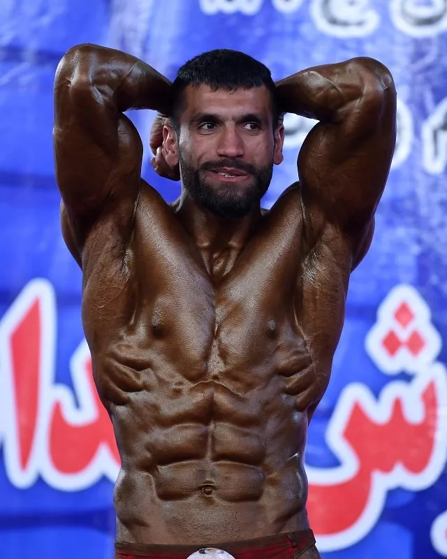 afghan bodybuilder hares mohammadi 25 posing during a bodybuilding and fitness contest in kabul photo afp afghan bodybuilder hares mohammadi 25 posing during a bodybuilding and fitness contest in kabul photo afp