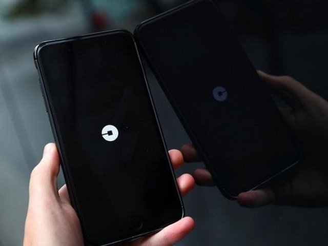 the uber logo is seen on mobile telephone in london britain september 25 2017 photo reuters