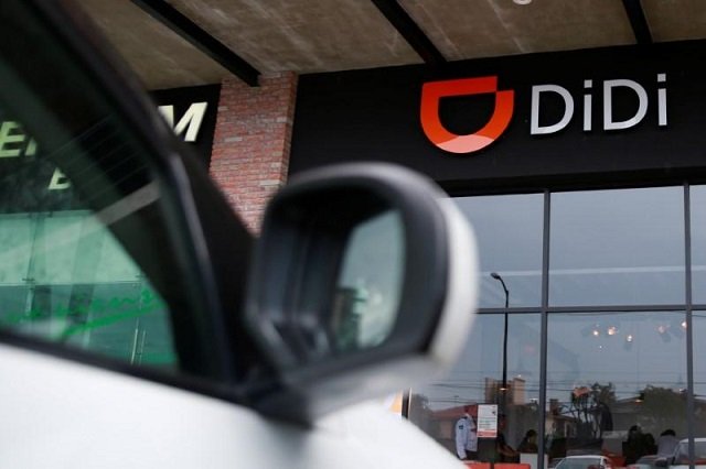 the logo of chinese ride hailing firm didi chuxing is seen at their new drivers center in toluca mexico april 23 2018 photo reuters