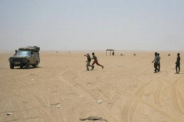 the migrants and refugees described being rounded up in the hundreds at a time squeezed into trucks for hours on end to what is known as point zero and then being dropped in the desert and pointed towards niger they walk sometimes at gunpoint photo courtesy al jazeera the migrants and refugees described being rounded up in the hundreds at a time squeezed into trucks for hours on end to what is known as point zero and then being dropped in the desert and pointed towards niger they walk sometimes at gunpoint photo courtesy al jazeera