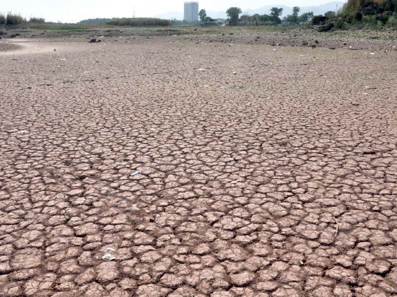 a view of dry bed of rawal lake on tuesday phoho online