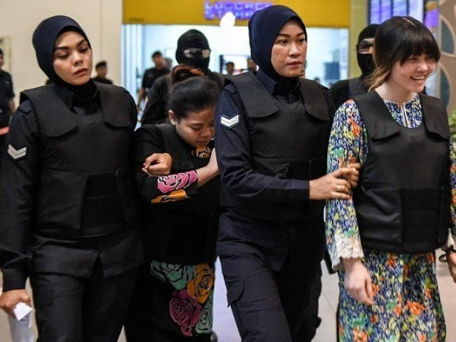vietnamese defendant doan thi huong r and indonesian defendant siti aishah 2nd l are escorted by police personnel photo afp vietnamese defendant doan thi huong r and indonesian defendant siti aishah 2nd l are escorted by police personnel photo afp