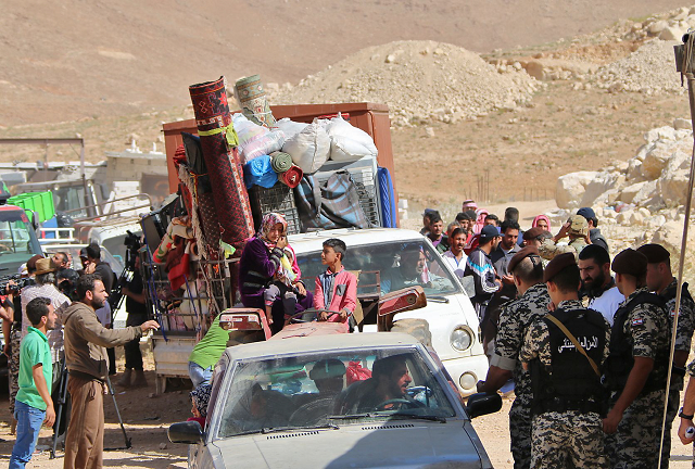 lebanese security forces check identity and papers of syrian refugees getting ready to cross into syria from the eastern lebanese border town of arsal lebanon photo afp lebanese security forces check identity and papers of syrian refugees getting ready to cross into syria from the eastern lebanese border town of arsal lebanon photo afp