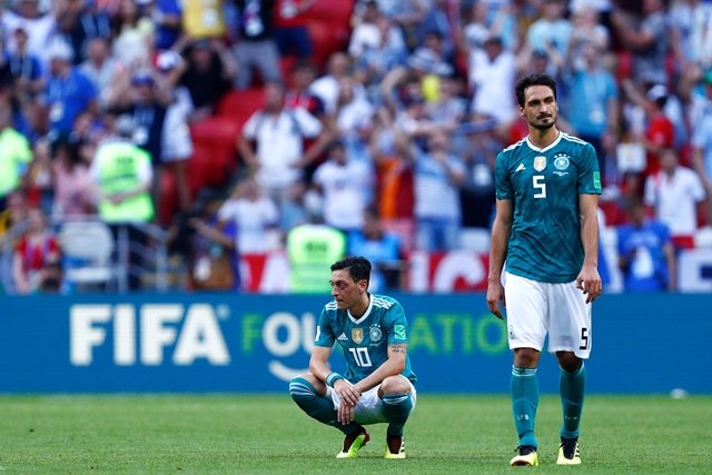 germany 039 s defender mats hummels and germany 039 s midfielder mesut ozil react to their defeat photo afp